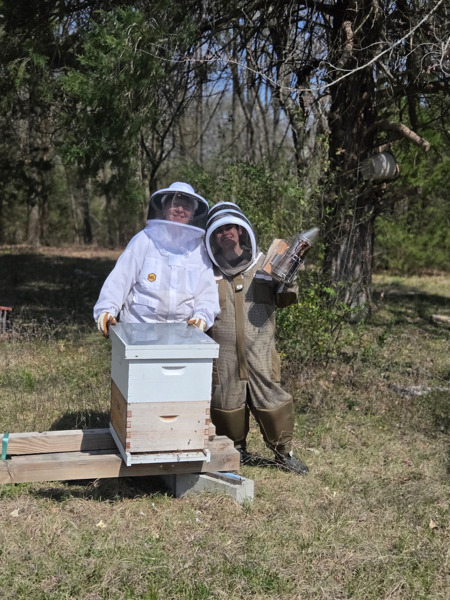 Suzanne and Nicki Magee working a hive at Magee Meadow Apiary